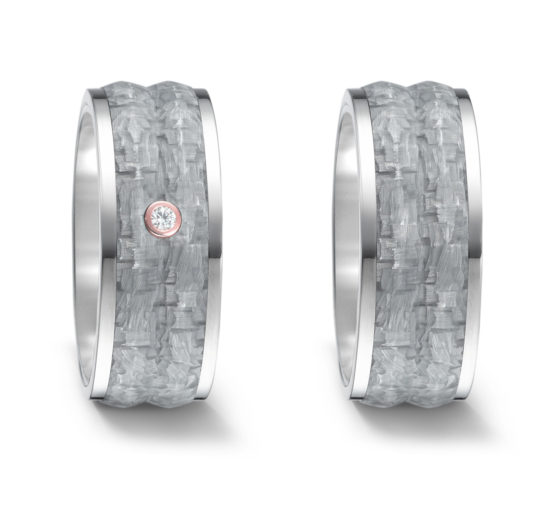 Wedding rings or friendship rings in titanium and gray carbon with a little diamond.