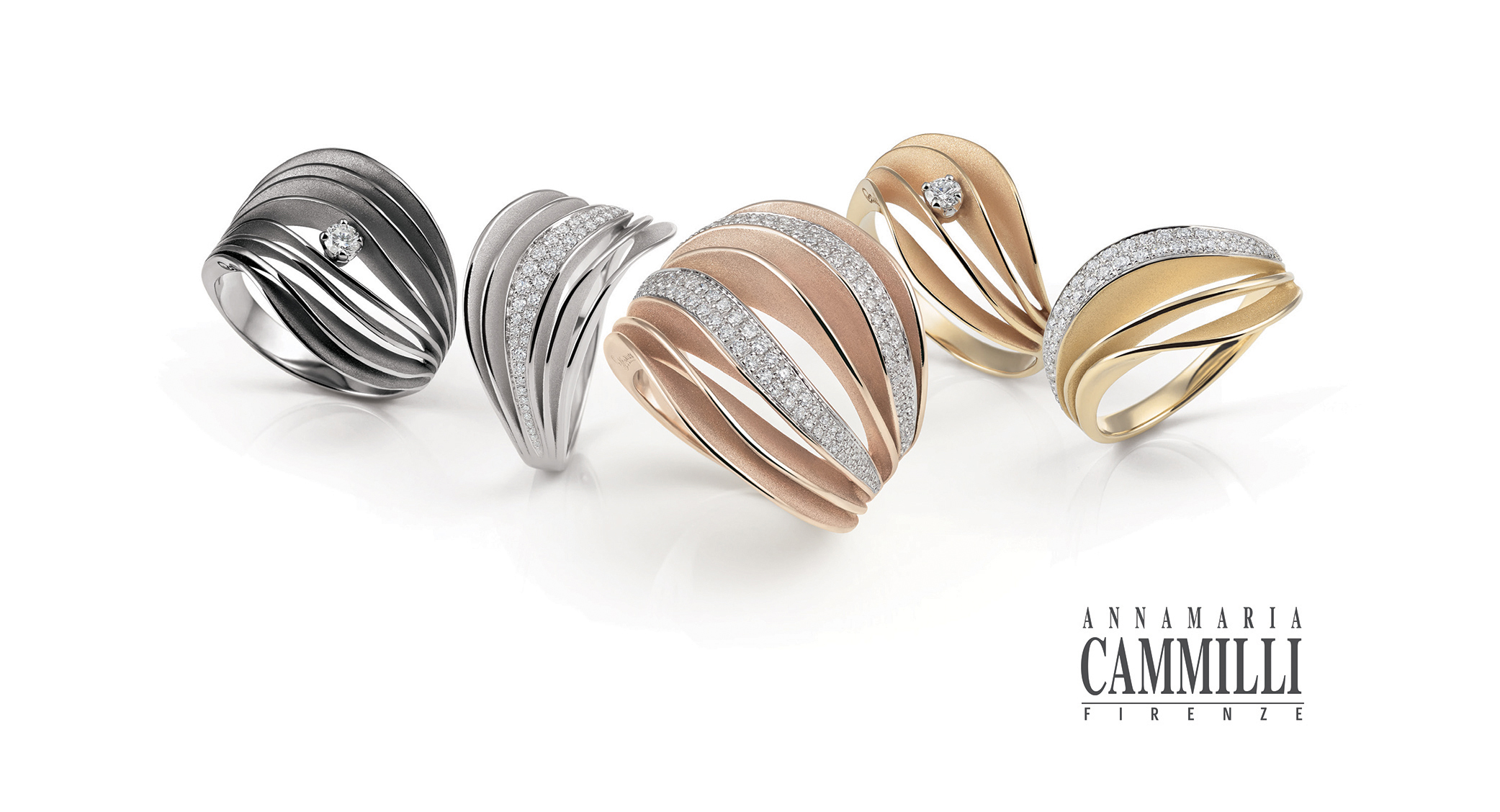 Five 18 carat golden rings with diamonds from the Velaa collection by Annamaria Cammilli.