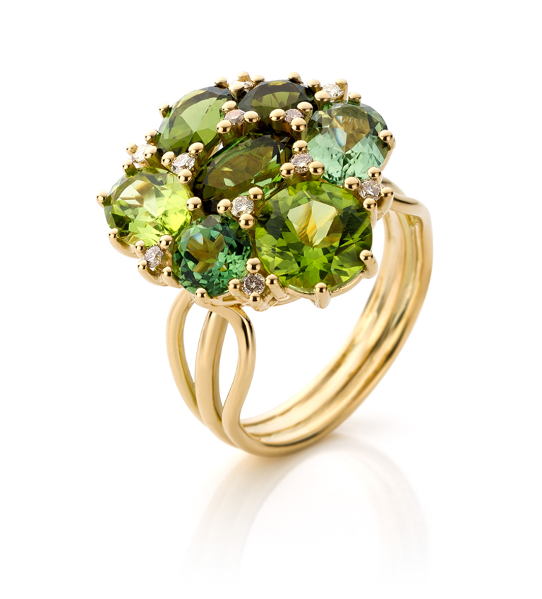 18 carat yellow gold ring with five green tourmalines, two peridots and small brown diamonds.