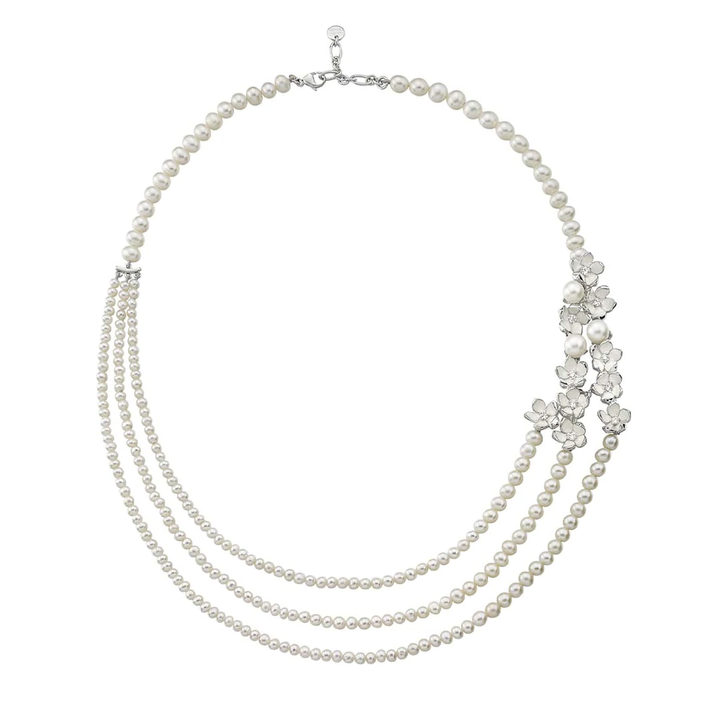 Classic silver three-strand pearl necklace features clusters of diamond-set Cherry Blossom flowers.