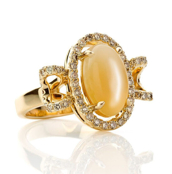 18 karat one-of-a-kind gold ring with a moonstone surrounded by beautifully sparkling brown diamonds.